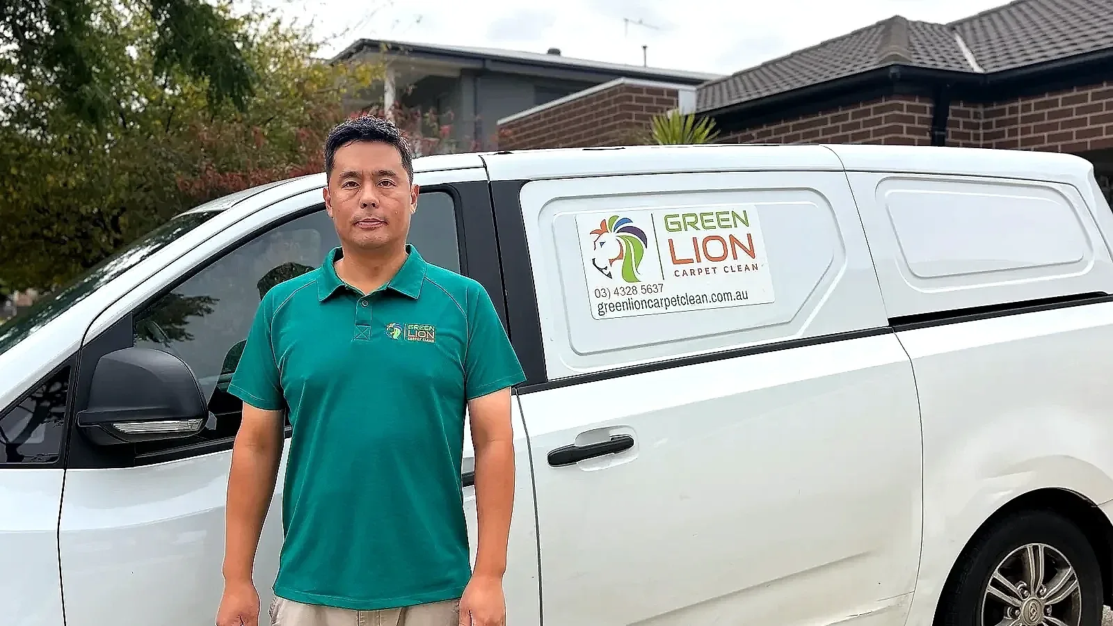 Jin, the owner of Green Lion Carpet Clean, standing beside his branded work van in Melbourne’s west