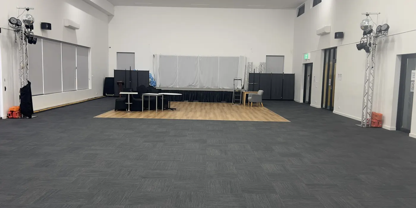 The main hall at Philippine Community Centre in Laverton after a Green Lion carpet clean, commercial carpet tiles across the full floor.