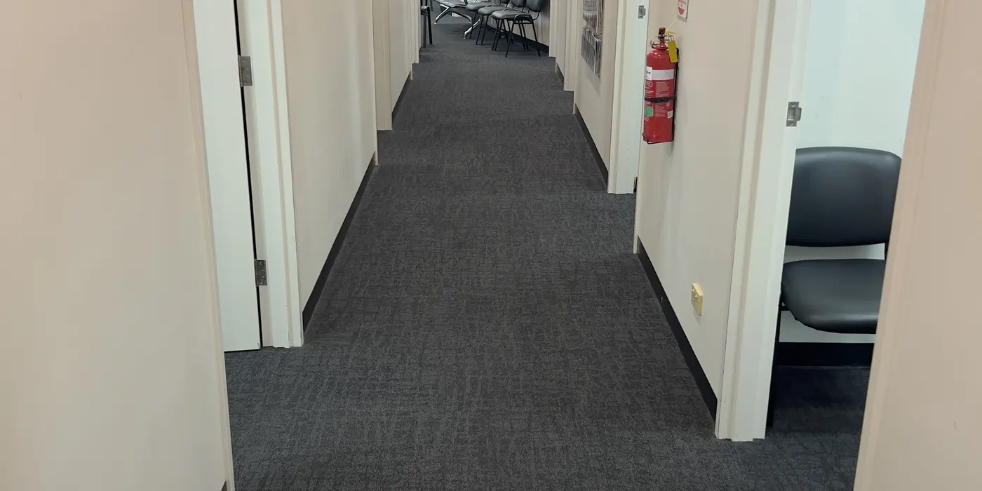 Commercial corridor carpet in Tarneit, cleaned along the full run of doorways.