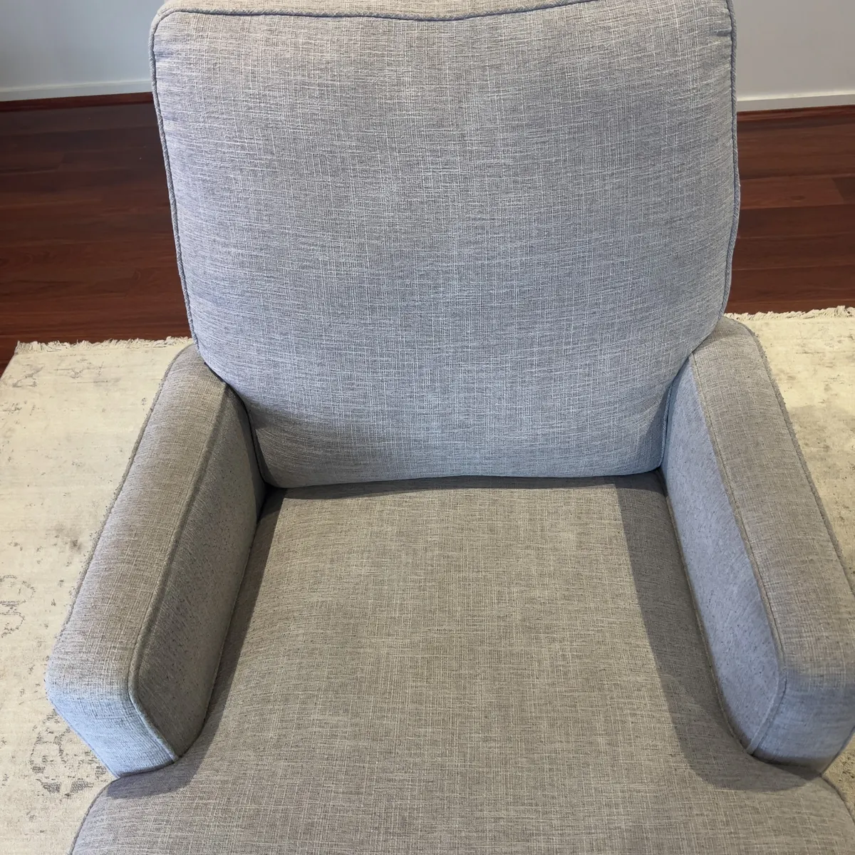 The same Point Cook recliner after cleaning, back on the freshly cleaned rug