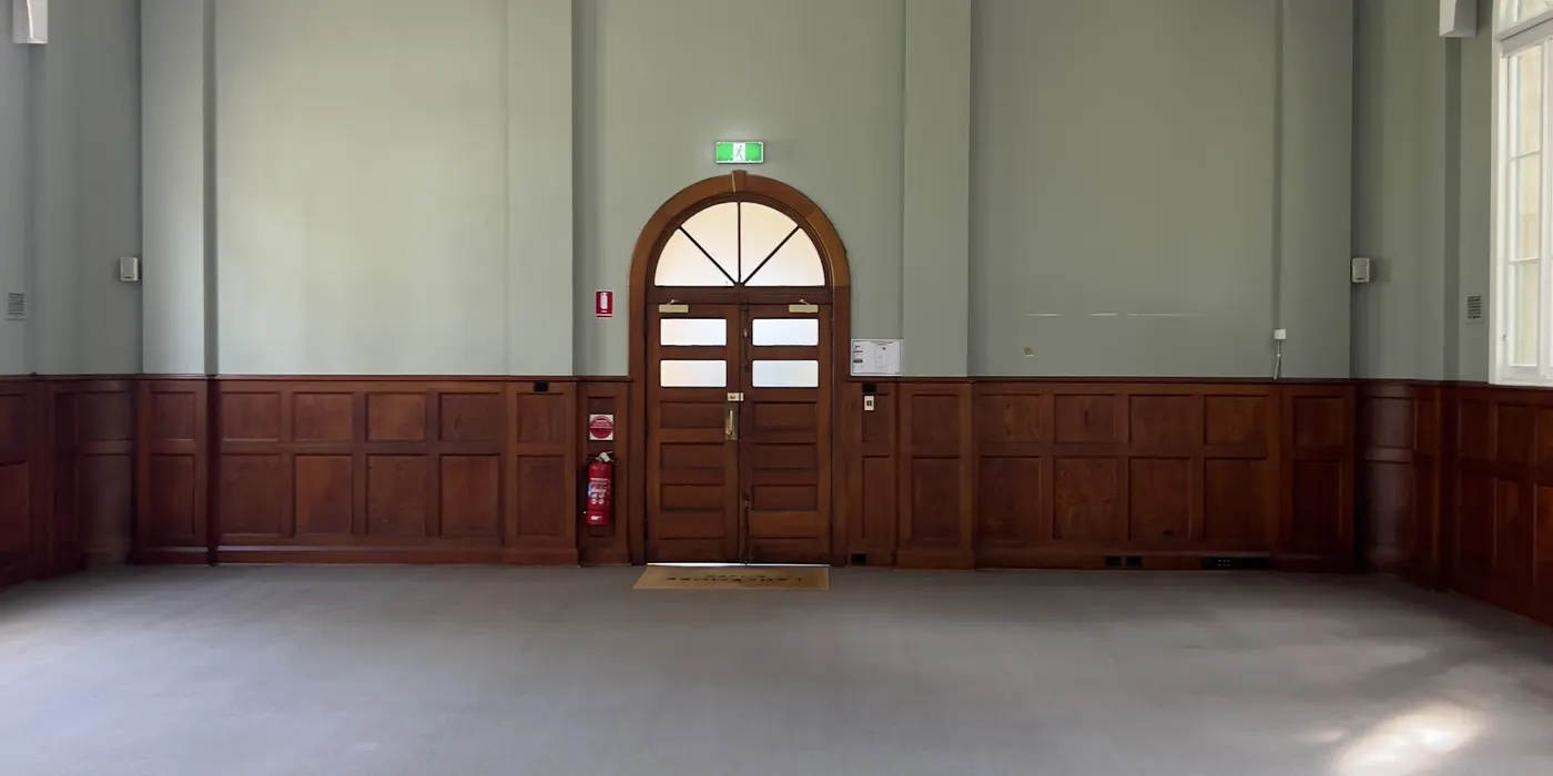 Freshly dry-cleaned carpet running the width of a heritage function hall