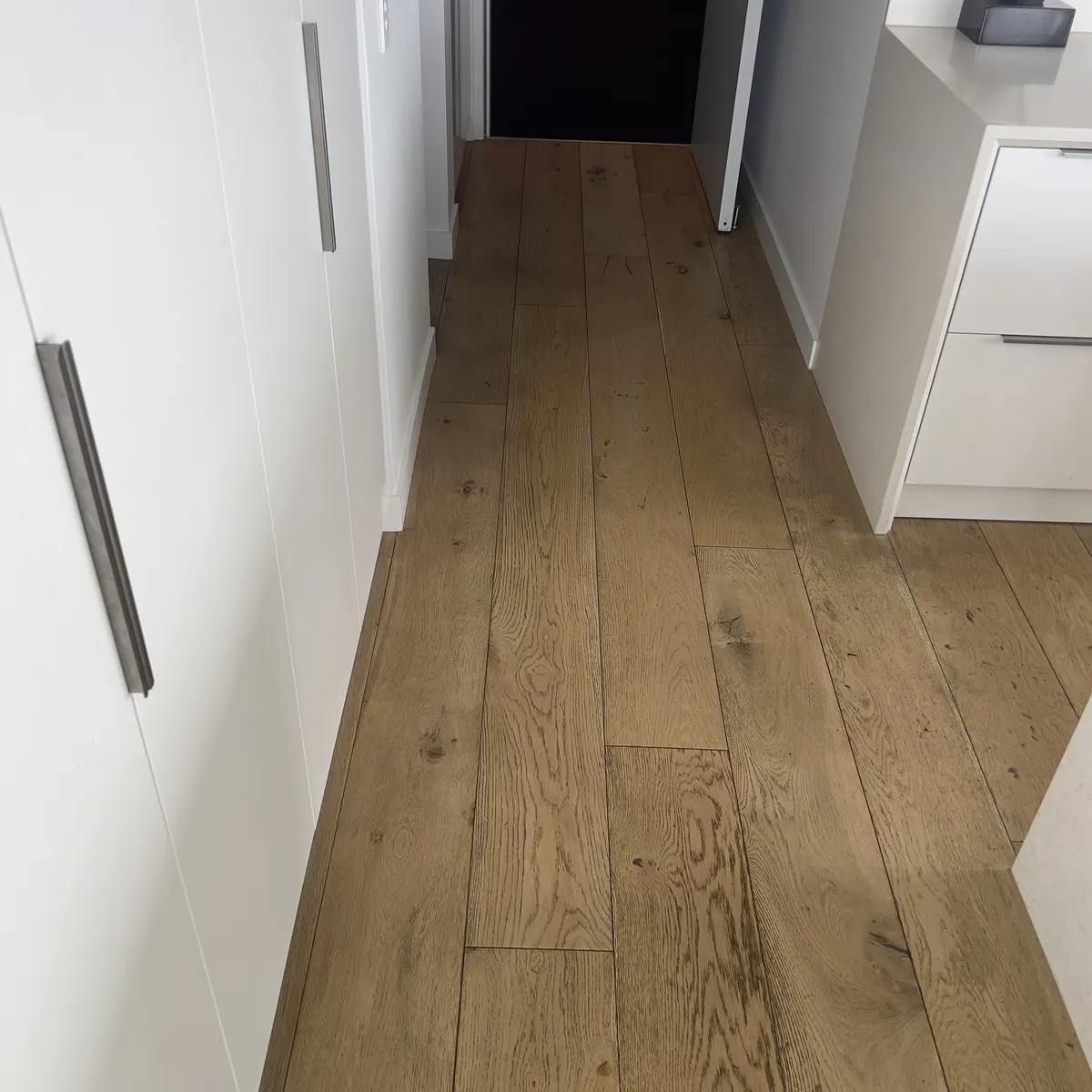 Timber hallway floor in the same Williamstown apartment after the clean.