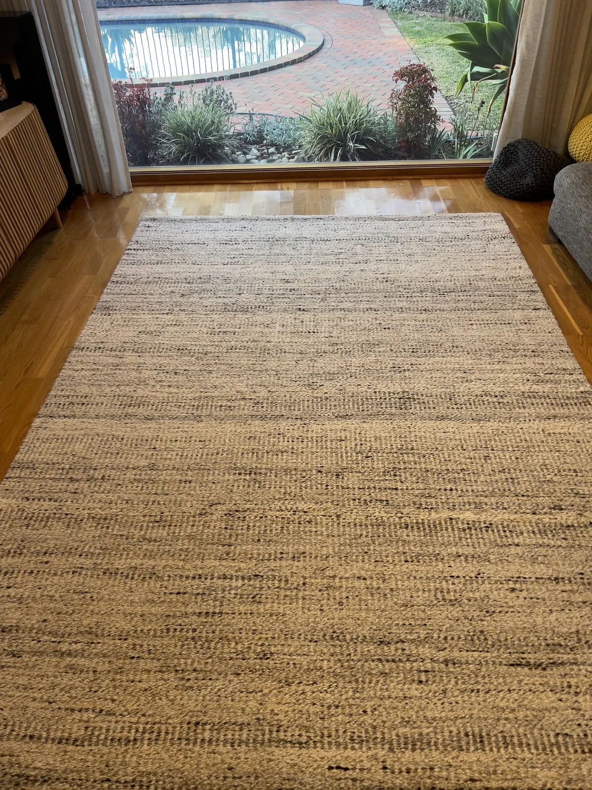 A large woven lounge rug after a Green Lion rug clean on a real Werribee job.
