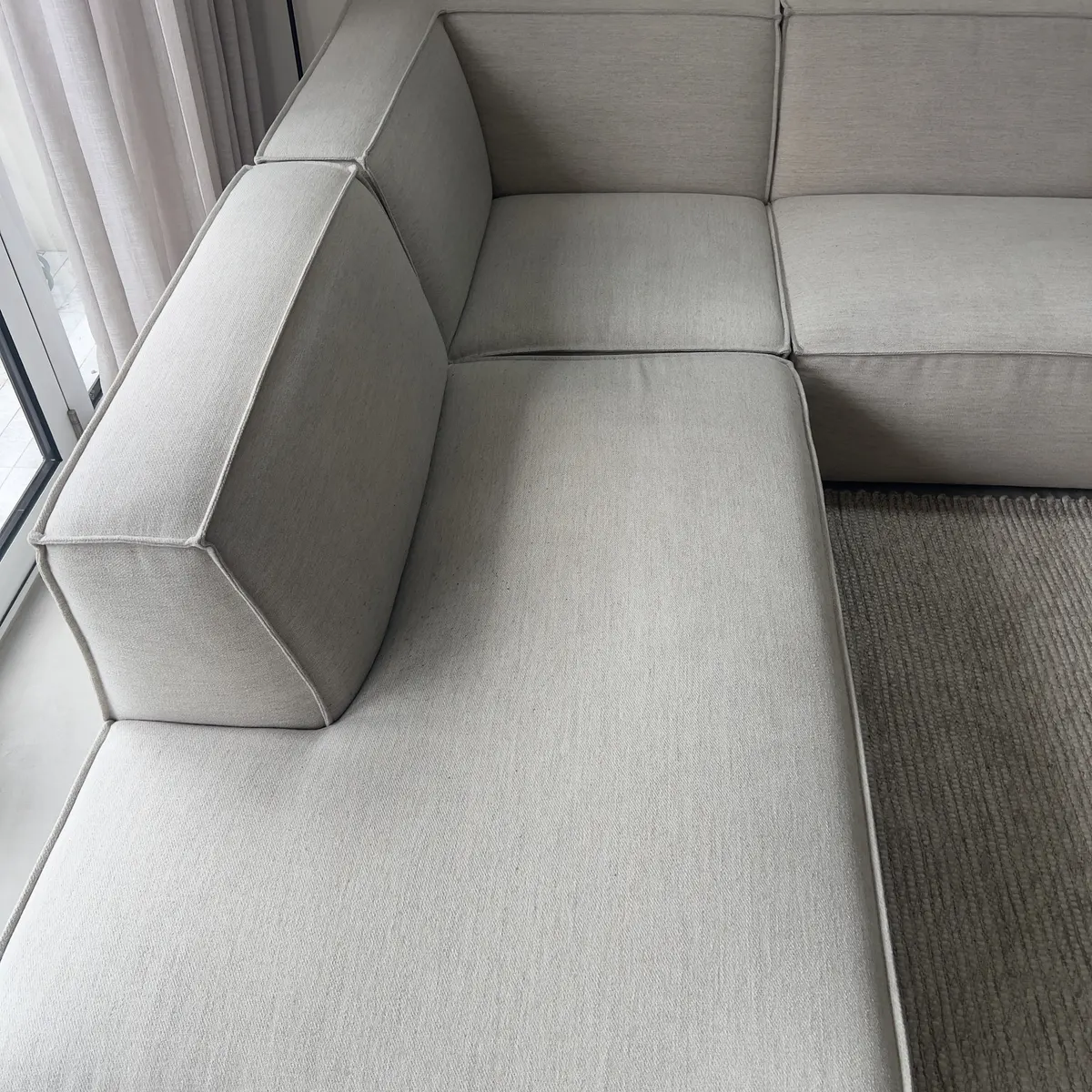 Cream modular fabric sofa after a Green Lion upholstery clean