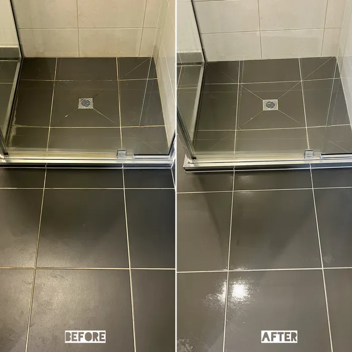 Dark bathroom floor and shower base tiles before and after a tile and grout clean by Green Lion