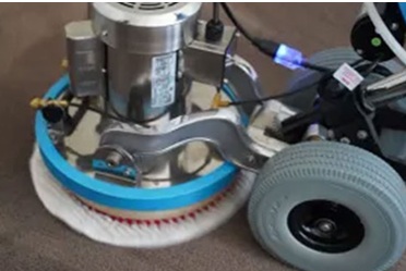 VLM Capet Cleaning A VLM (Very Low Moisture) carpet cleaning unit being used to clean grey carpet.